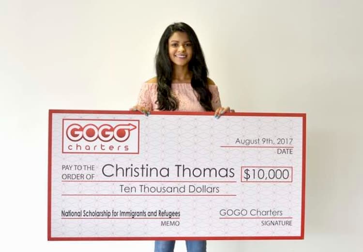 Christina Thomas with her scholarship check