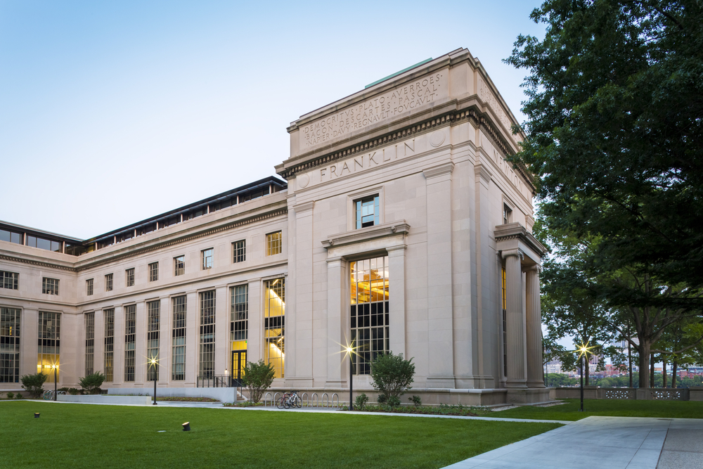 the exterior of a prominent MIT building at dusk