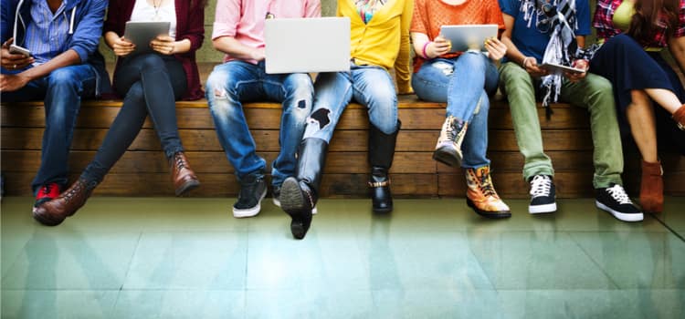 A cropped image of peoples legs in a row