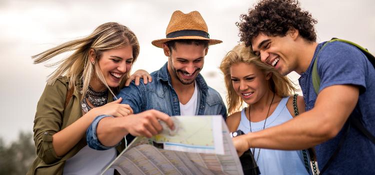 A group of tourists looking at a map