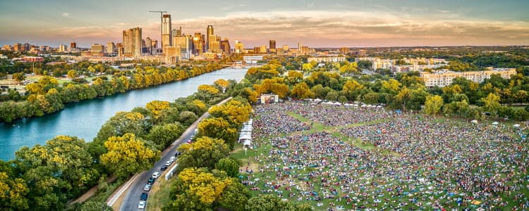 birdeye view of a riverside festival in Austin TX