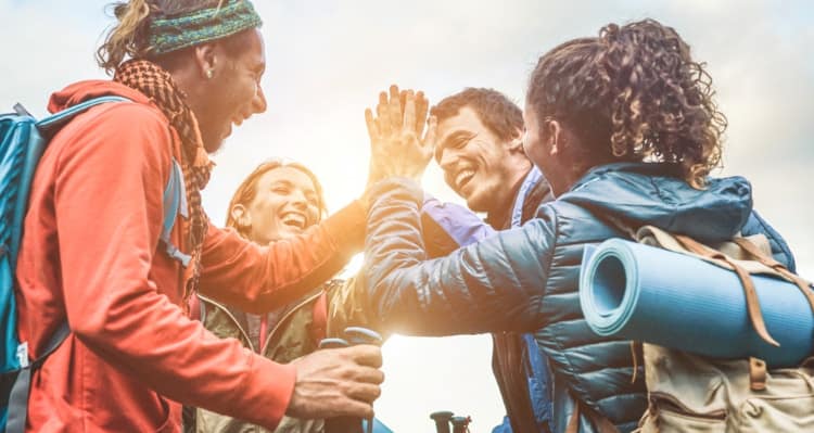 A group of people giving each other high fives