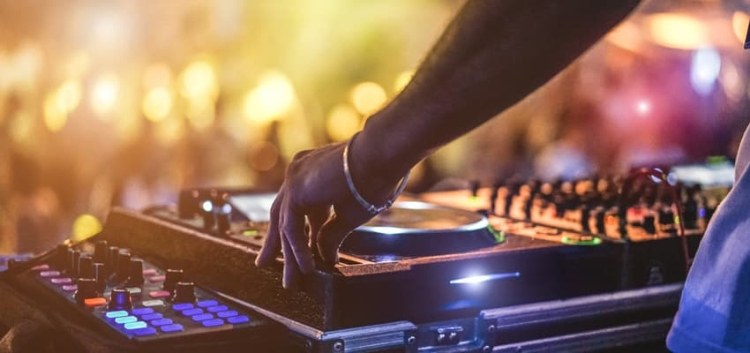 A DJ playing a set at a club 