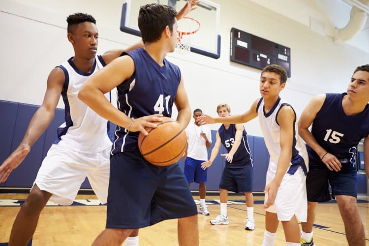 boys in blue basketball uniforms during a game