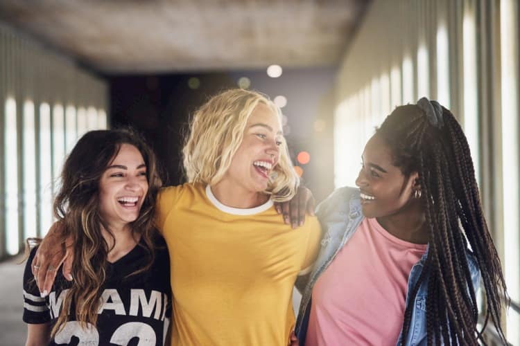 College girls laughing together