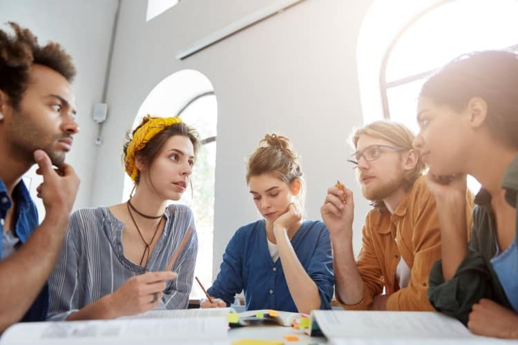 A group of college students having a discussion