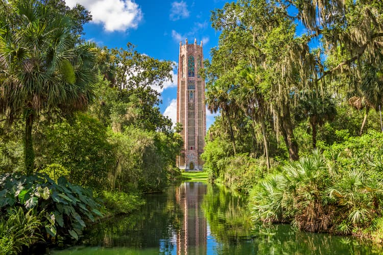 The Bok Tower rising above bright green vegetation