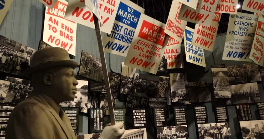 An exhibit of protestors holding signs at the National Civil Rights Museum in Memphis. 