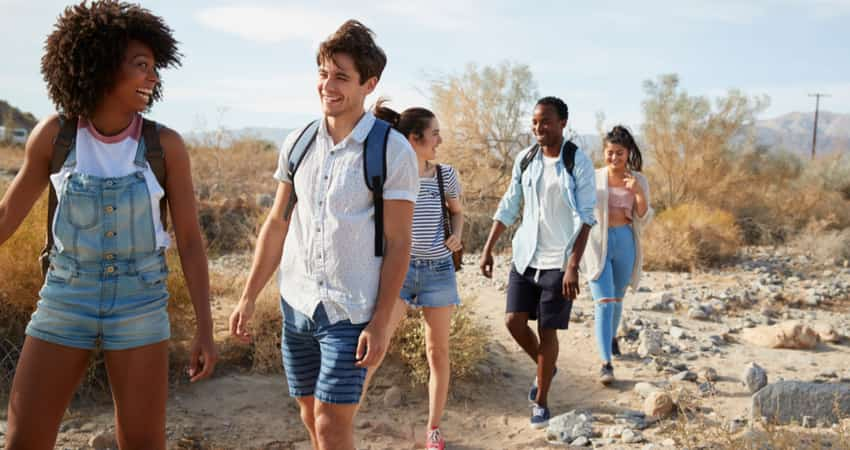 A group of friends going for a desert hike