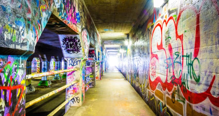 interior of the Krog Street Tunnel, lined with graffiti