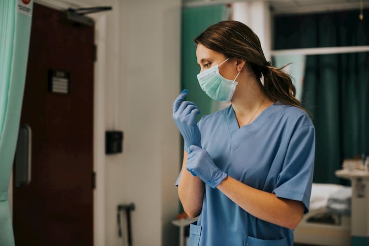 Nurse in mask and gloves