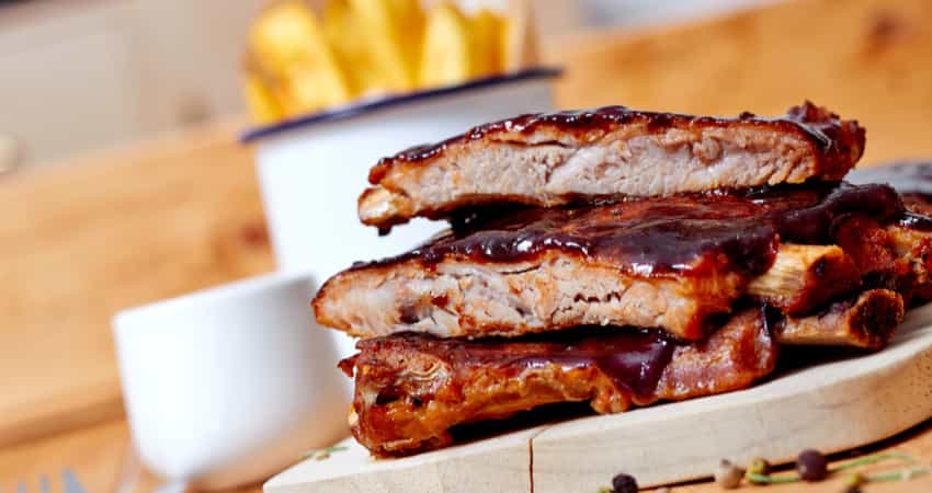 A rib plate with fries at a barbecue restaurant 