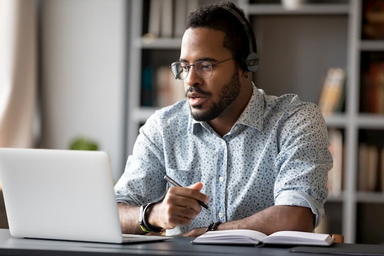 Man at laptop working from home