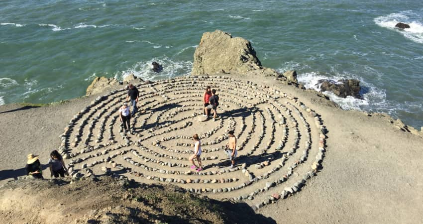 Hikers navigate the rock labyrinth in Land's End Park in San Francisco