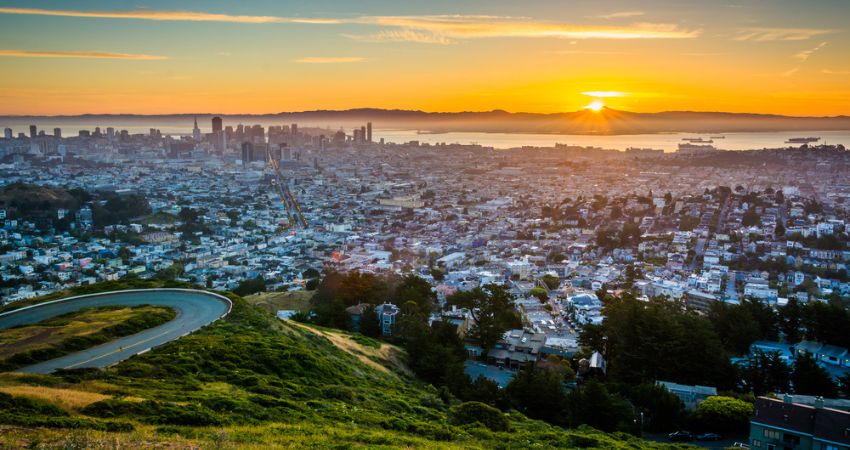 View of San Francisco skyline at sunset from the top of Twin Peaks lookout point