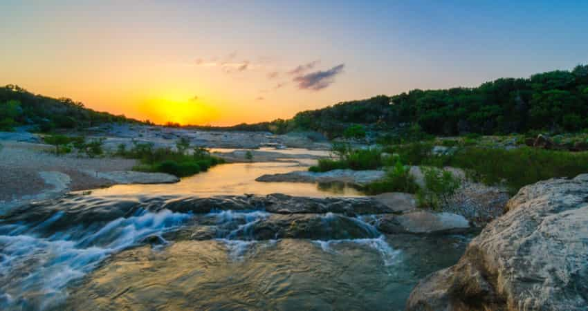 The sunset over Pedernales River Waterfall at Pedernales State Park