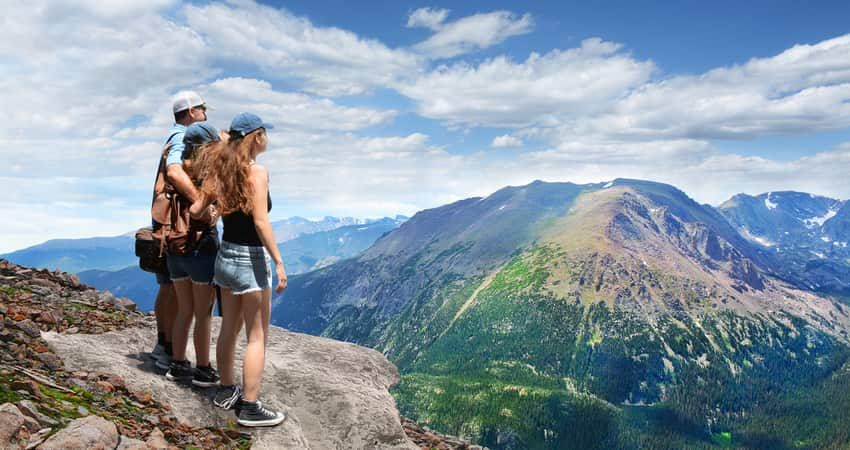 A group of people at the top of Trail Ridge Road in Rocky Mountains National Park