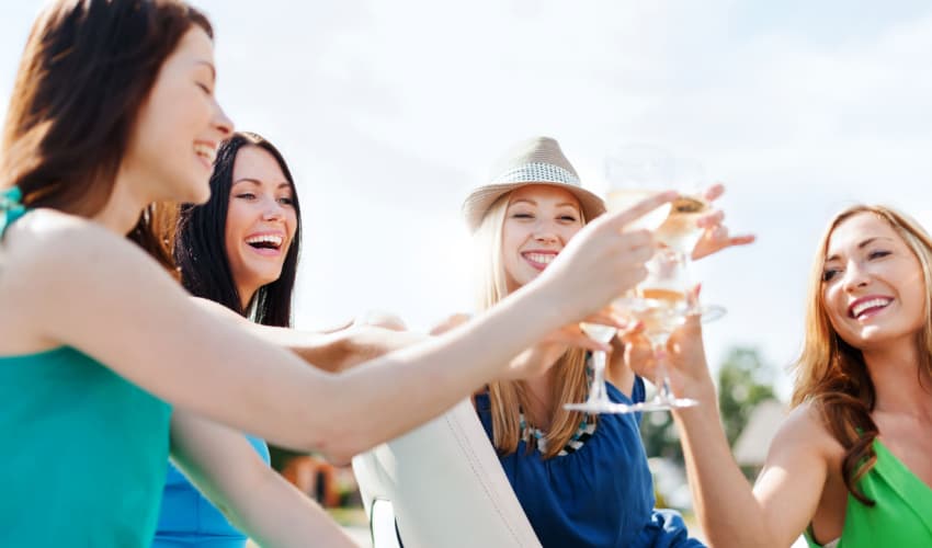 A group of friends toasting wine