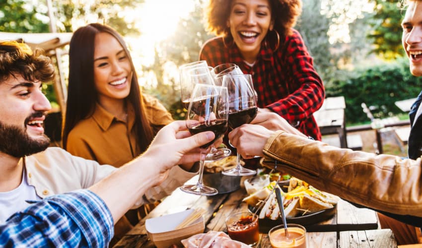 A group of friends toasting wine