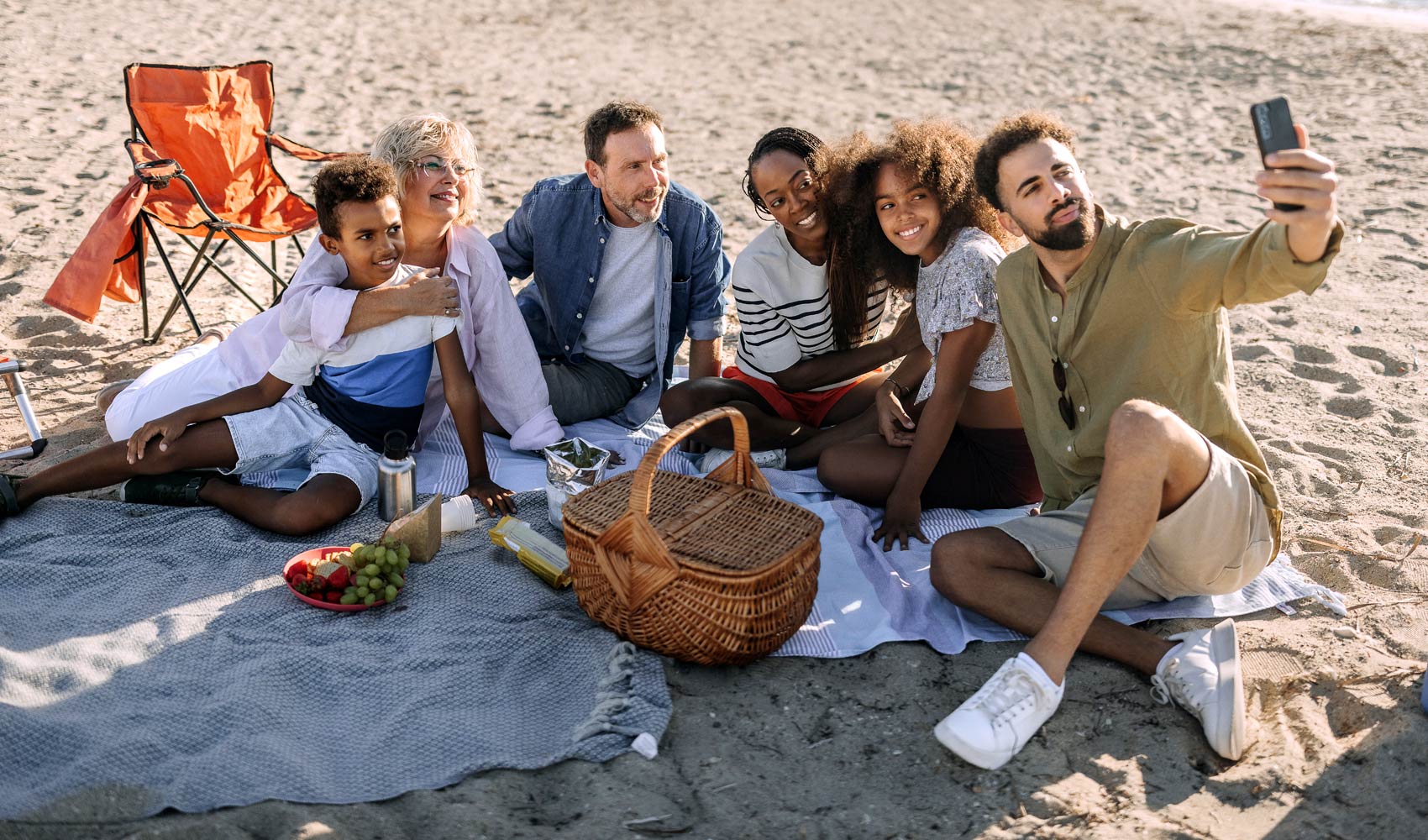 family taking a selfie on the beach