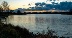 a tranquil lake at dusk in orland park