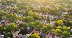 Aerial view of a tree-lined suburban neighborhood