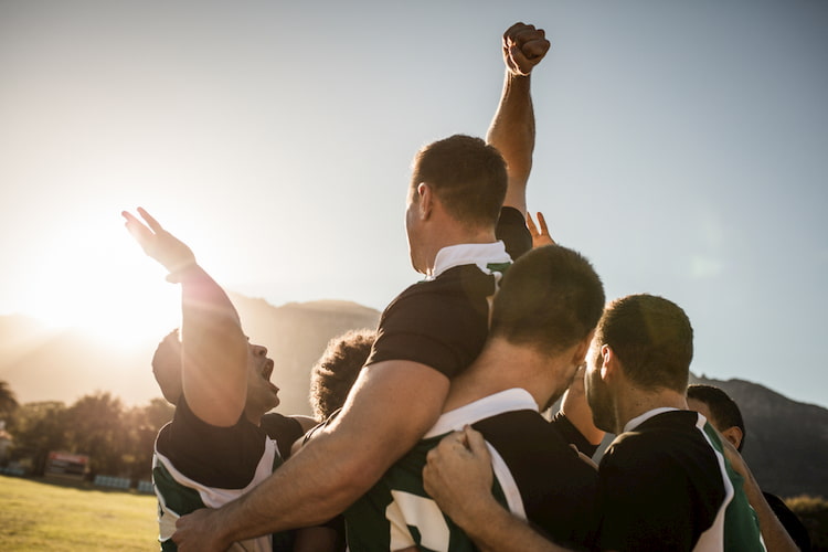 players cheer for each other at practice