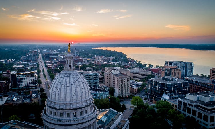 The Madison skyline at sunset, the lake visible from the air