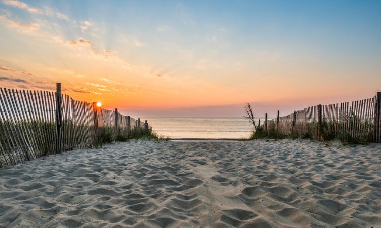 a sandy path to a Delaware Beach at sunset