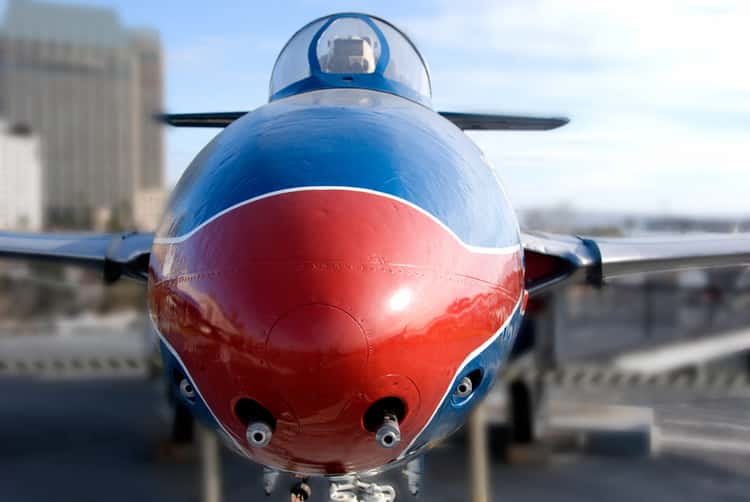 Red and blue air craft on the USS Midway