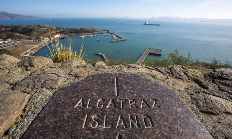 view of the engraved stone on alcatraz island, looking towards the inner bay area