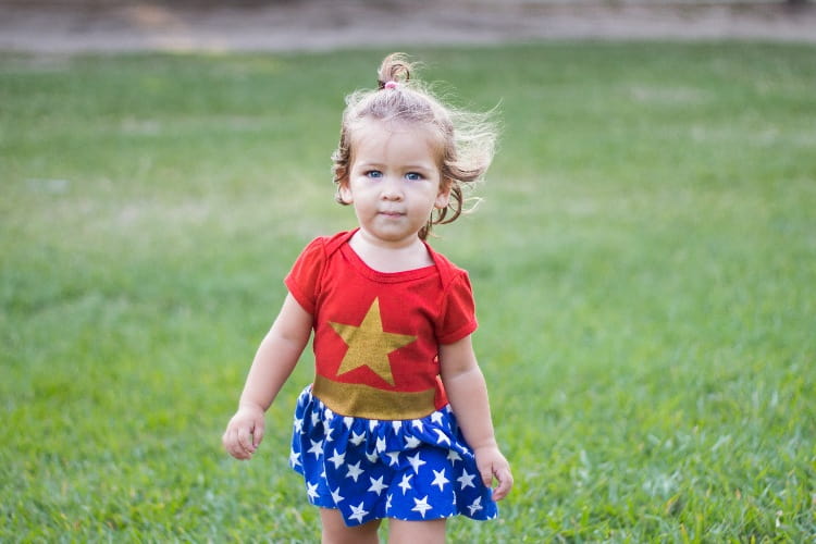Child girl wearing a cute Wonder Woman costume