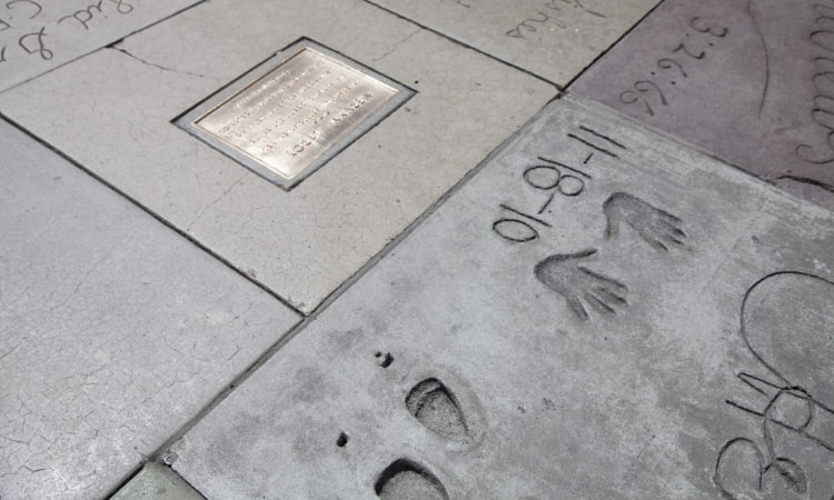 handprints and shoe prints in concrete outside the TCL Chinese Theatre