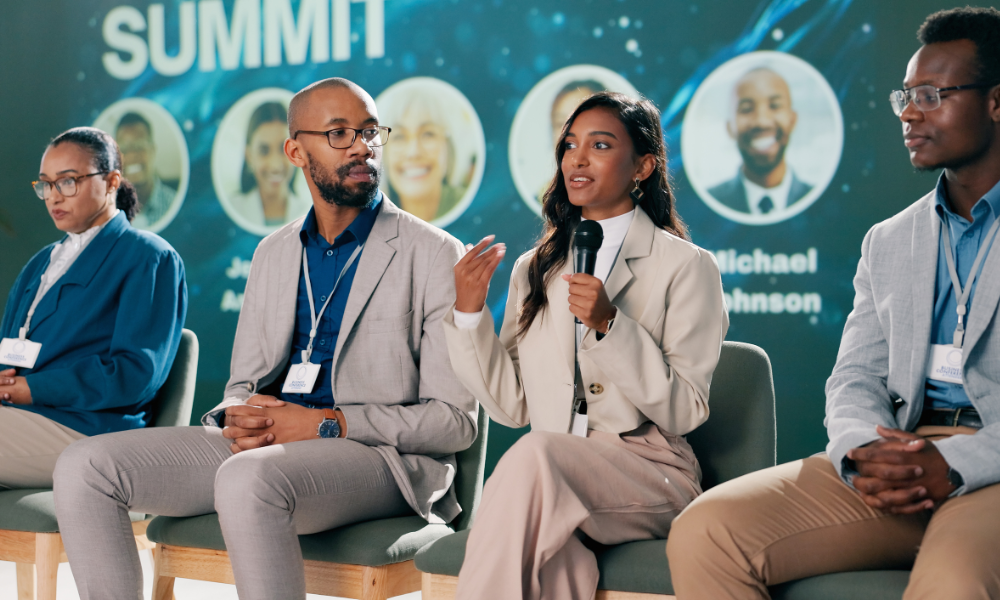 panelists speaking at a summit