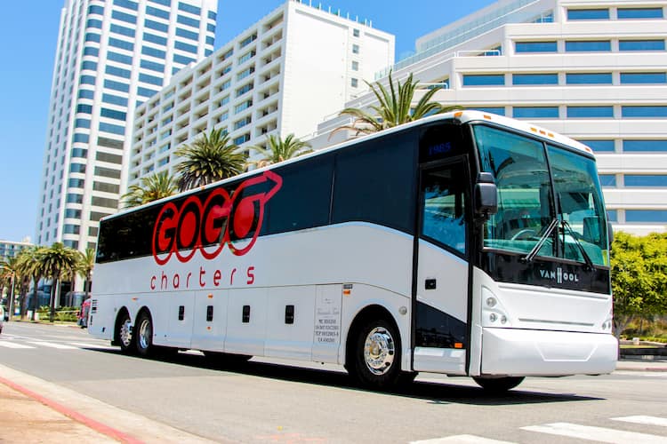 a bus from gogo charters prepares for departure