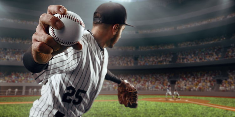 a baseball pitcher gets ready to throw a pitch