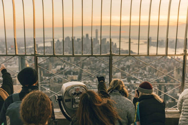 guests enjoy the expansive view from the top of the empire state building