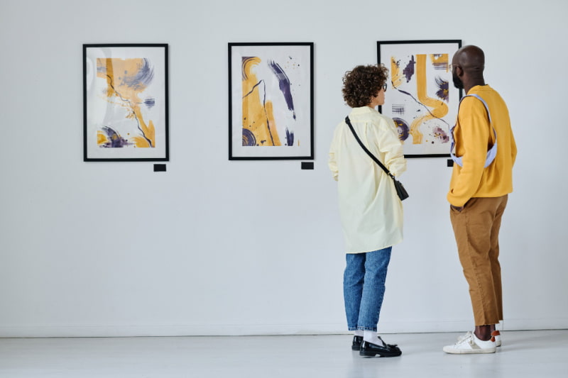 visitors admire art at an art museum