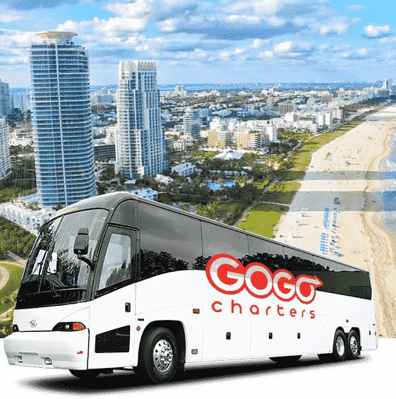 a GOGO Charters branded bus in front of the Miami skyline