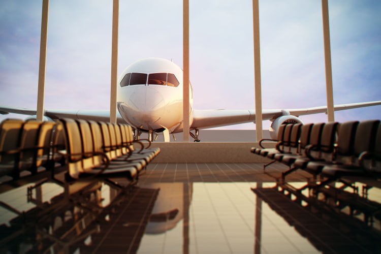 a large window at the airport with a plane parked outside