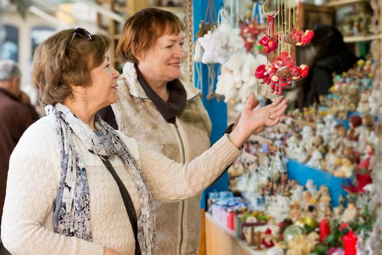 women shop for homemade goods at the yellow daisy festival