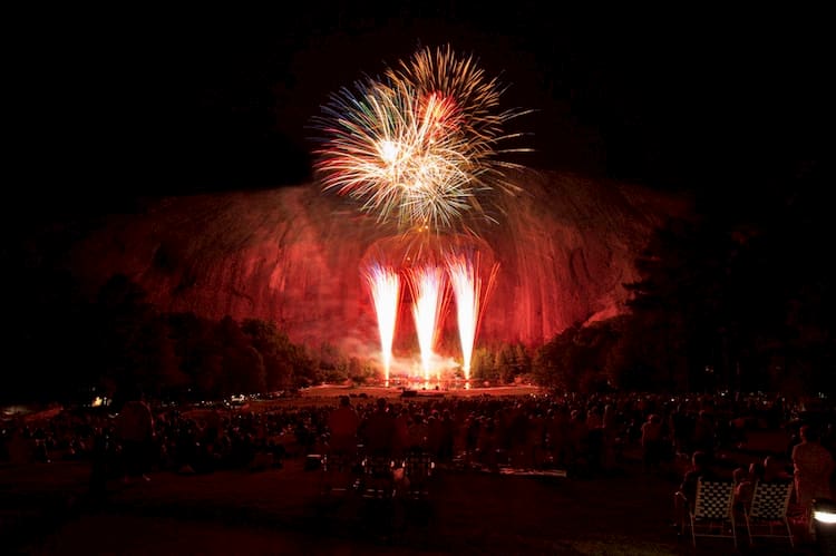 fireworks at night in front of stone mountain's carving