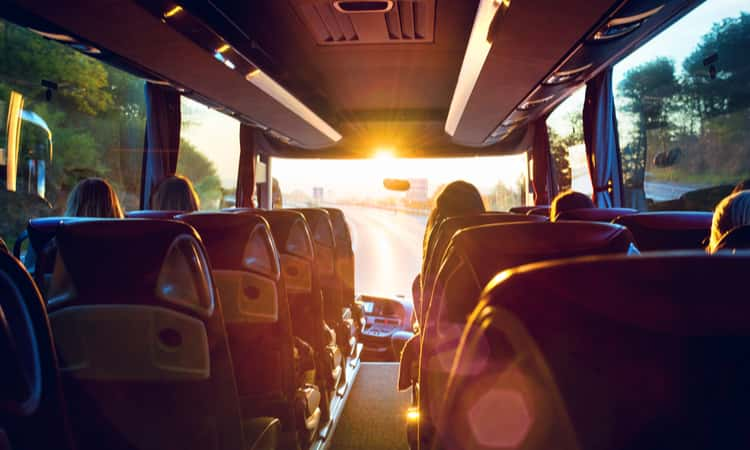 the interior of a charter bus while on the road