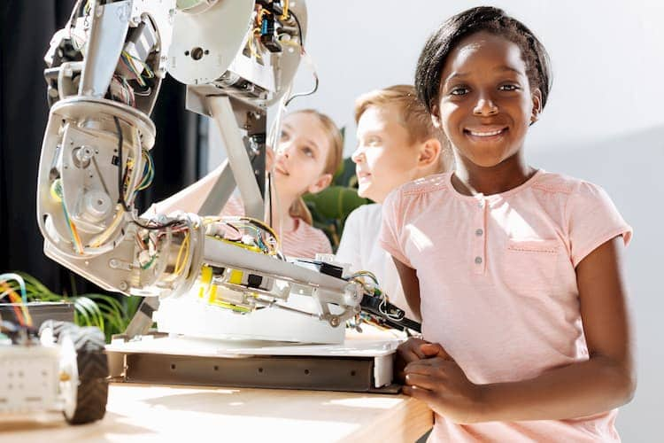 STEM girl standing and smiling at camera