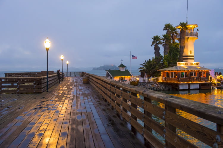 a view of pier 39 at night, after the rain