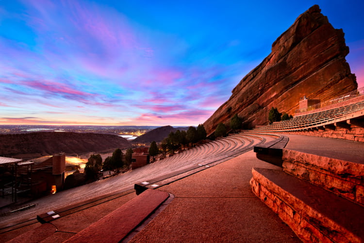 a view of the red rocks park amphitheater at dusk