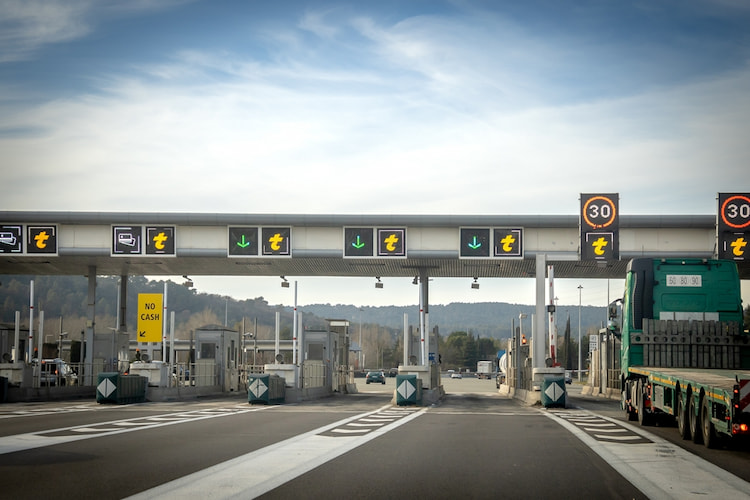 a large multi-lane toll booth on a highway