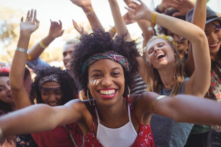 A selfie taken of a group of friends at a concert