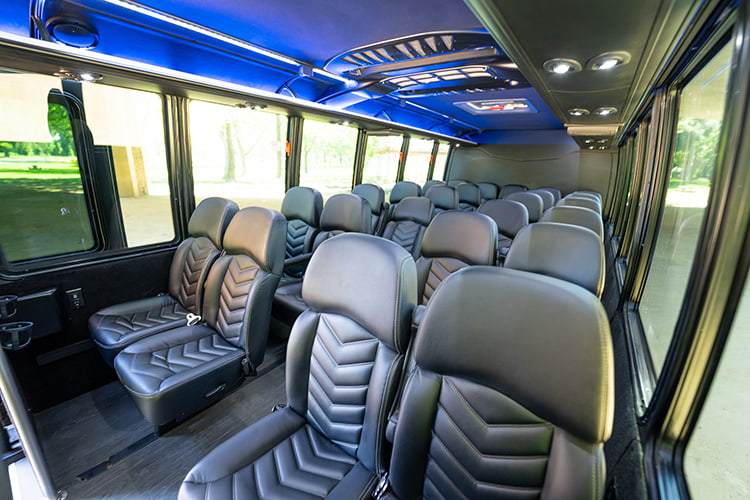 Shuttle bus interior with leather seats and LED lights