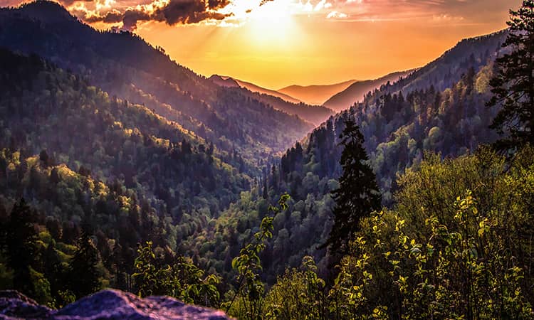 The sun sets over a rural valley in Tennessee